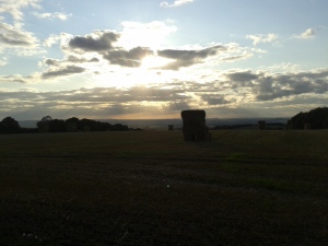Hay bales with the Vale of the White Horse in the background